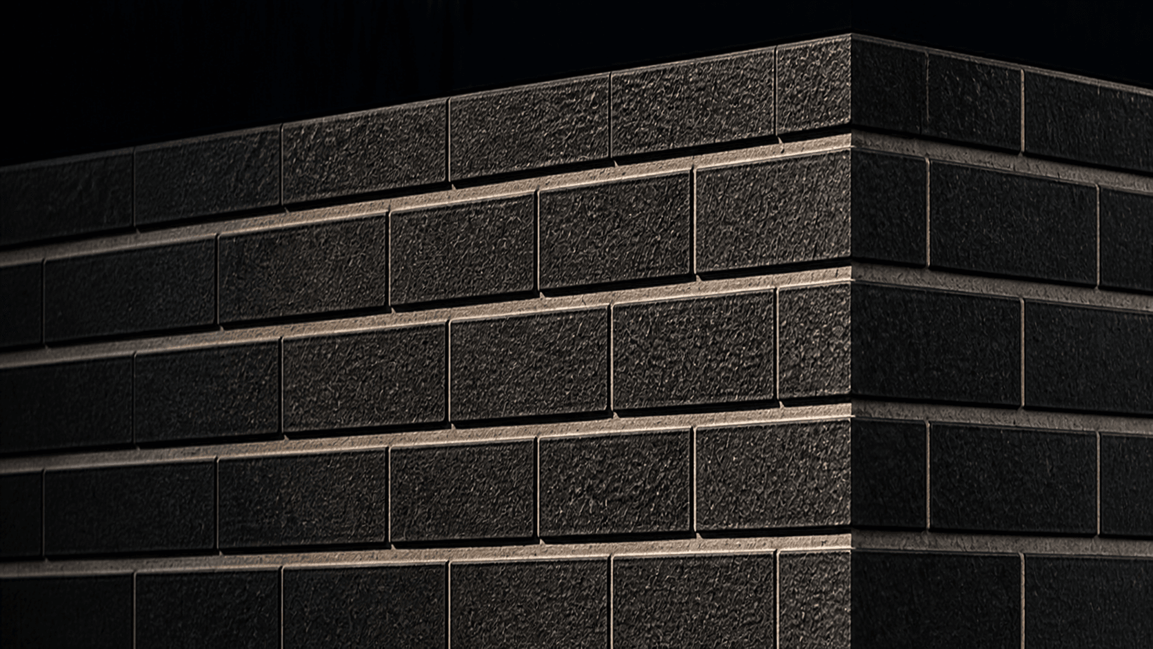 Completed dark clay brickwork corner detail